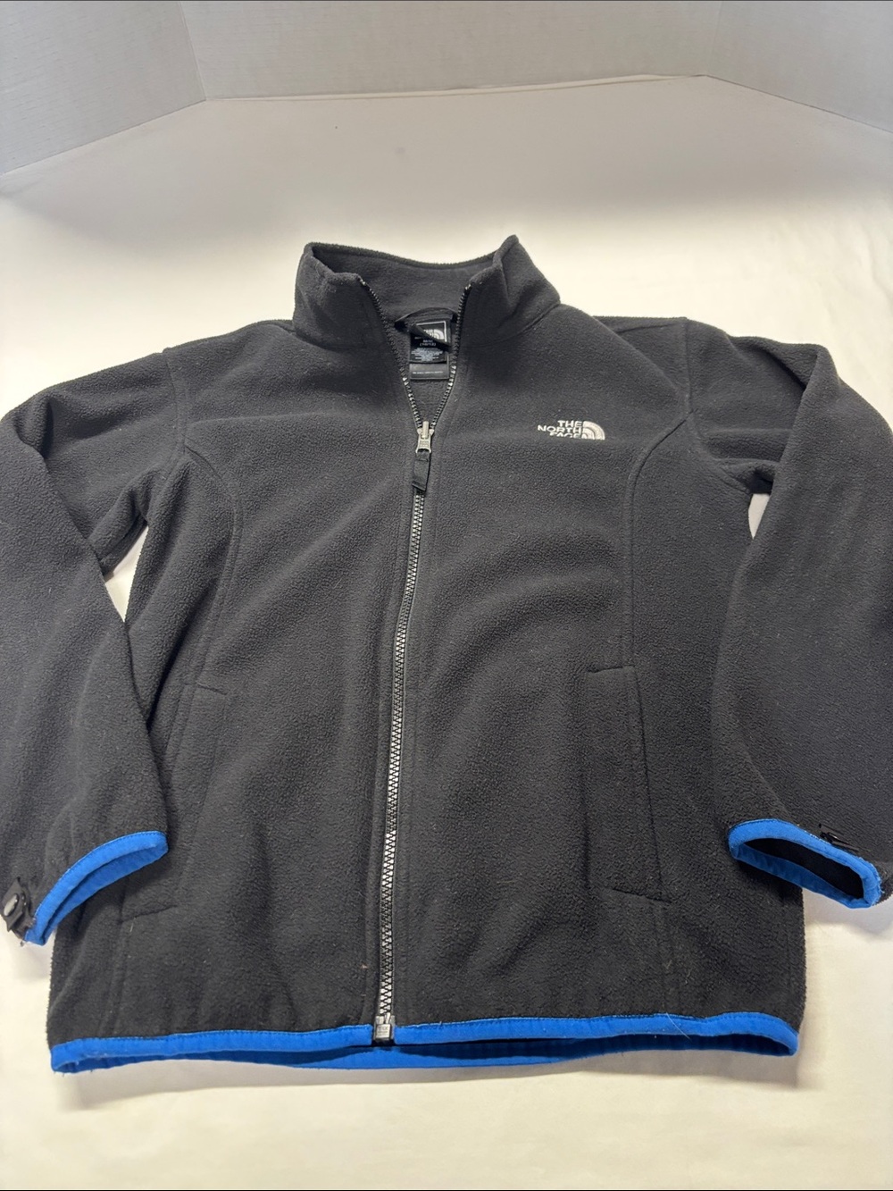 The North Face Kids Black Fleece Jacket with Blue Trim